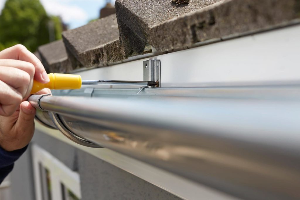 Depositphotos_3977455-min Image of person installing new gutters