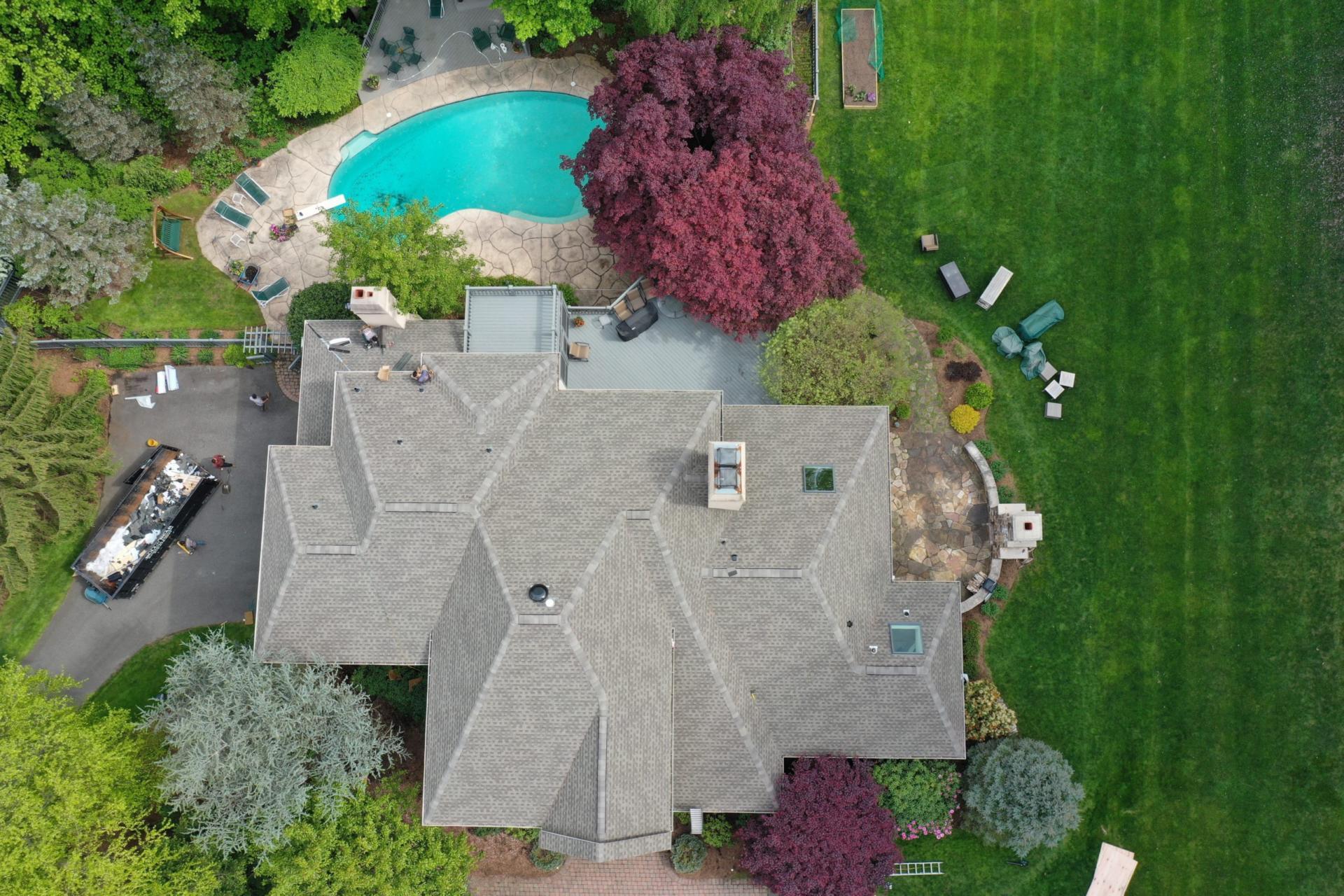 Far Hills, NJ Tudor home with cedar shake rook by Alte Exteriors GAF Timberline replacement roof on Chester, NJ home.