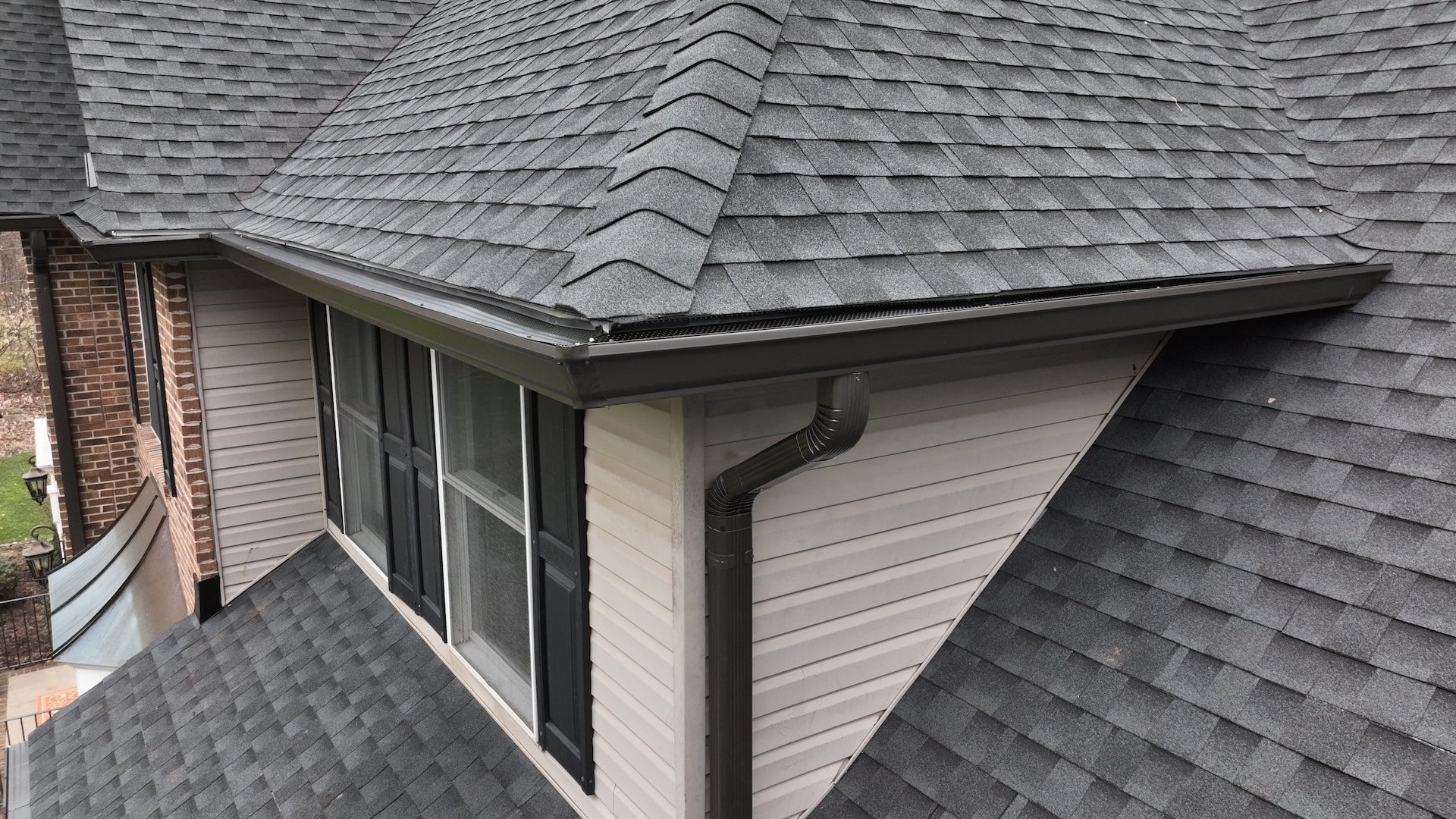 Gutters AFTER -min A before image of a home with damaged gutters before a replacement by Alte Exteriors.