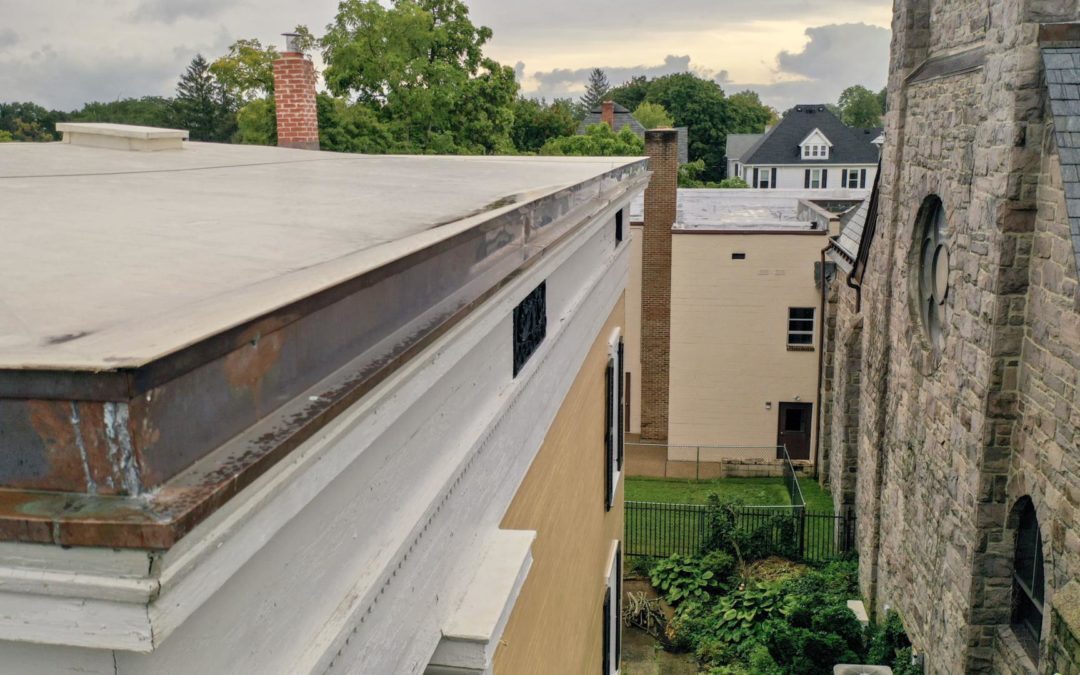 Image from commercial roofing project flat roof and custom copper details on a Historical Society building that was installed by Alte Exteriors LLC.